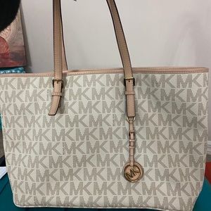 Used large monogram michael kors bag